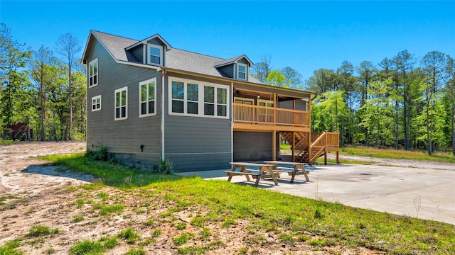 rear view of house featuring a patio