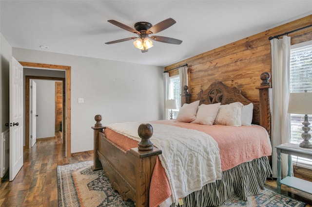 bedroom featuring ceiling fan and dark hardwood / wood-style floors