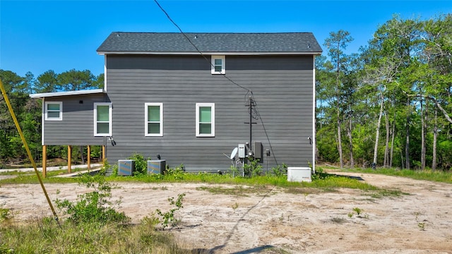 back of house with central AC