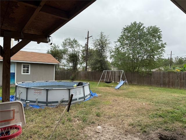 view of yard featuring a fenced in pool