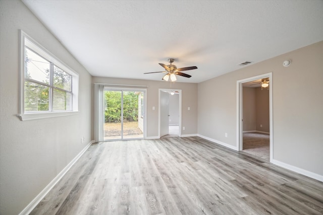 spare room featuring light wood-type flooring and ceiling fan