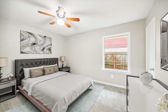 bedroom with light carpet and ceiling fan