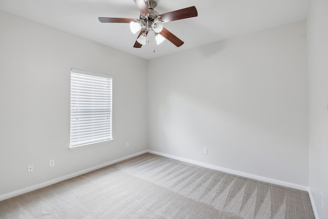 unfurnished room with light carpet and ceiling fan