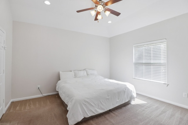 bedroom with ceiling fan and carpet floors