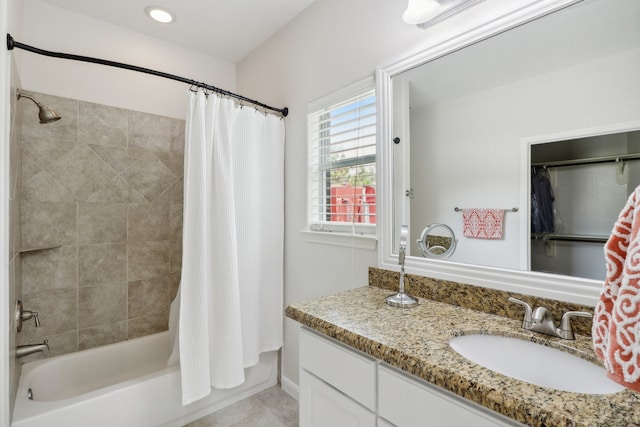 bathroom featuring vanity and shower / tub combo with curtain