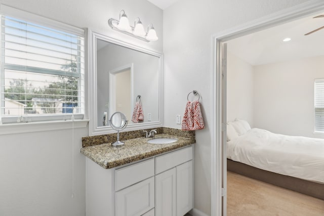 bathroom featuring vanity and ceiling fan