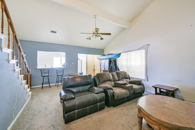 carpeted living room featuring ceiling fan, high vaulted ceiling, beamed ceiling, and bar