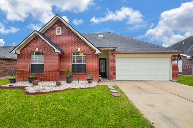 view of front of house with a garage and a front yard