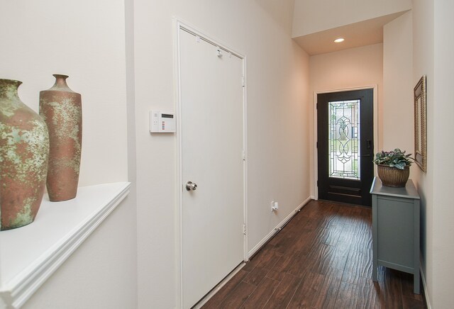 entryway with dark wood-type flooring