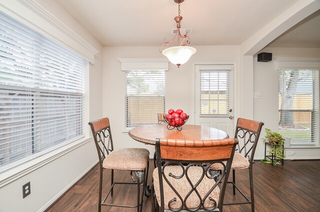 dining area featuring dark hardwood / wood-style floors