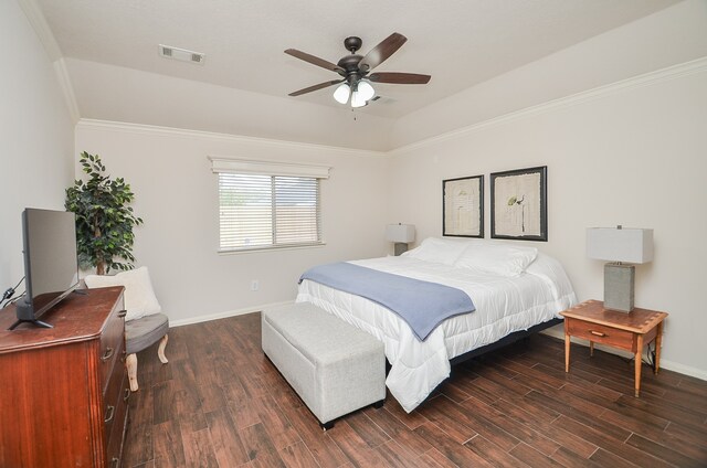 bedroom featuring dark wood-type flooring, ceiling fan, and crown molding