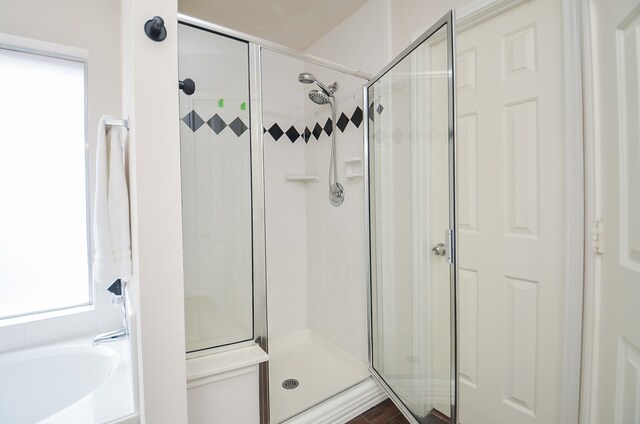 bathroom with independent shower and bath