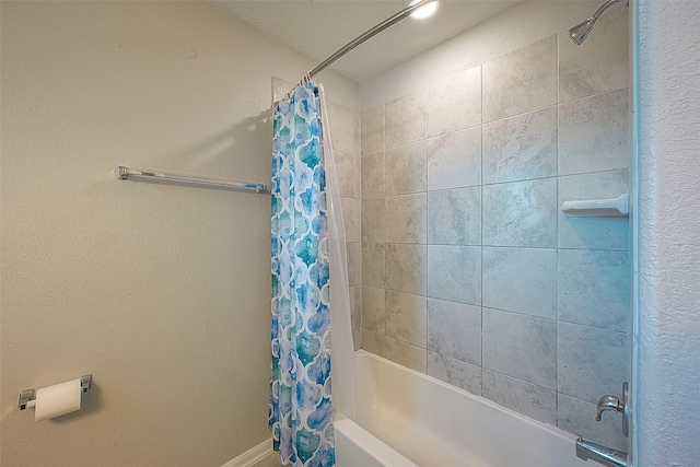 bathroom featuring shower / bath combination with curtain