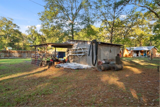 view of outbuilding with a yard