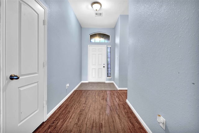 doorway to outside featuring dark hardwood / wood-style flooring