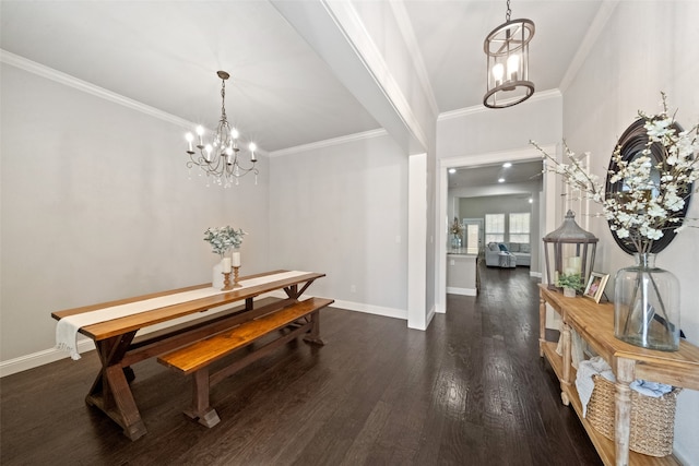 dining room featuring ornamental molding, an inviting chandelier, and dark hardwood / wood-style floors