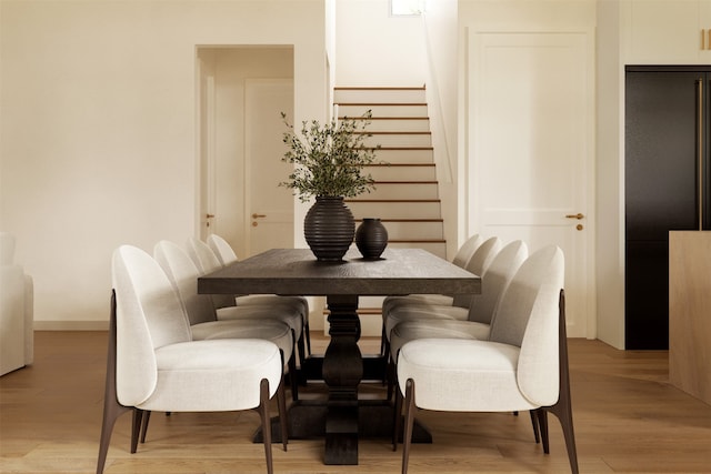 dining area with light hardwood / wood-style floors