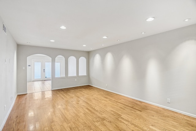 spare room with light hardwood / wood-style floors