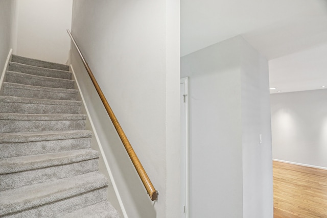 stairway featuring hardwood / wood-style flooring