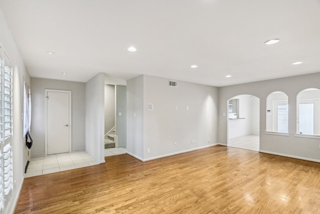 spare room featuring light hardwood / wood-style floors