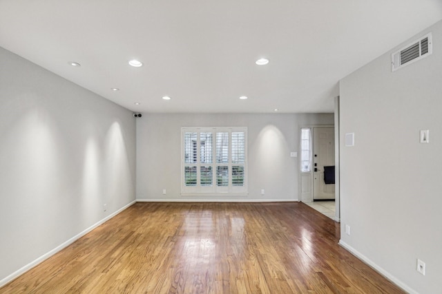 spare room with light hardwood / wood-style floors