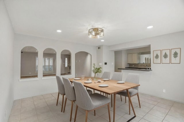 dining area featuring light tile patterned flooring