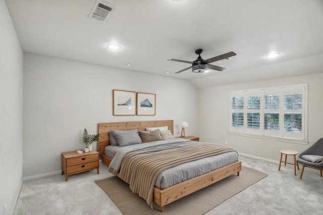 bedroom with light carpet and ceiling fan