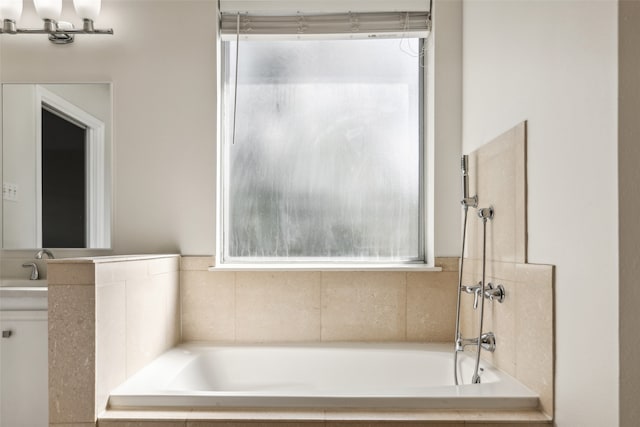 bathroom with tiled tub