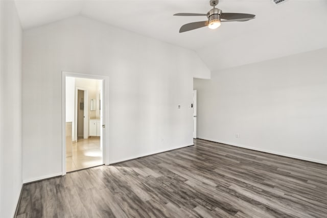 unfurnished room with lofted ceiling, ceiling fan, and dark hardwood / wood-style flooring