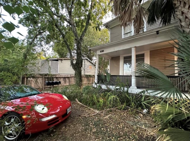 view of property exterior with covered porch