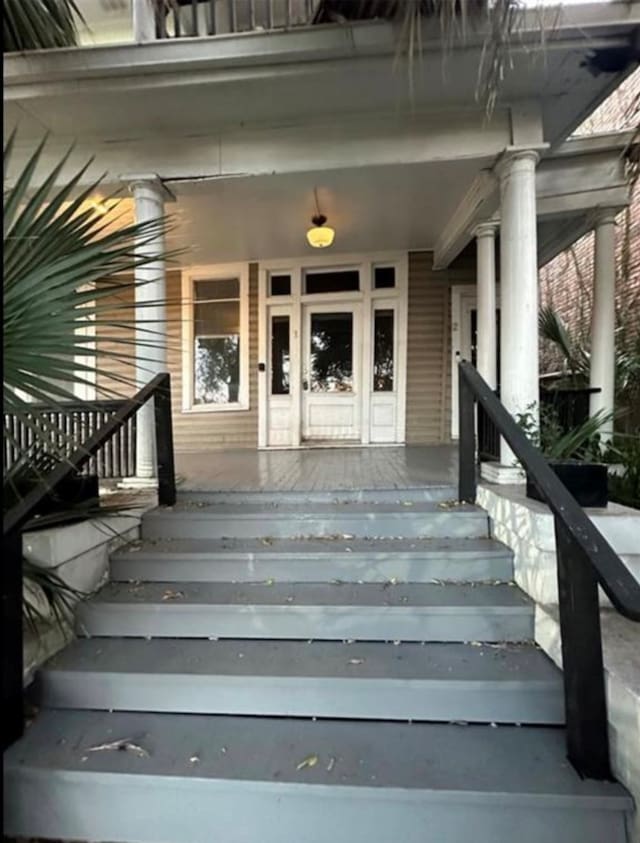 property entrance with covered porch