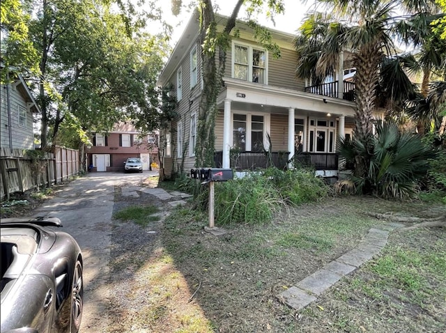 view of front of home featuring covered porch and a garage