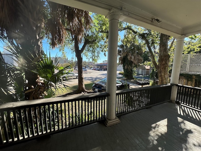 wooden terrace with a porch