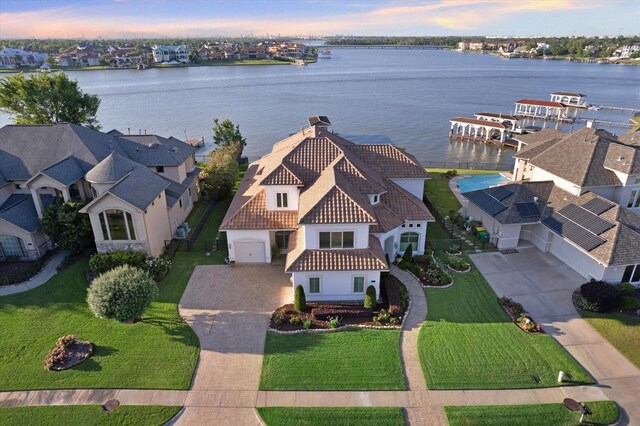 aerial view at dusk with a water view