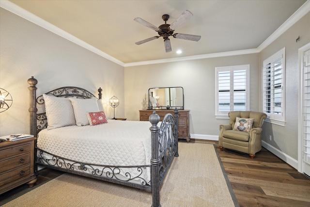 bedroom with ceiling fan, dark hardwood / wood-style floors, and ornamental molding