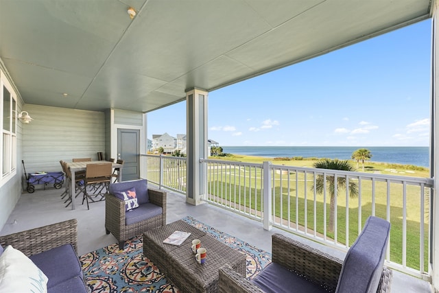 exterior space featuring an outdoor hangout area, a yard, and a water view