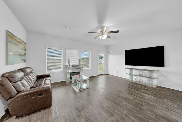 living room with ceiling fan and hardwood / wood-style floors