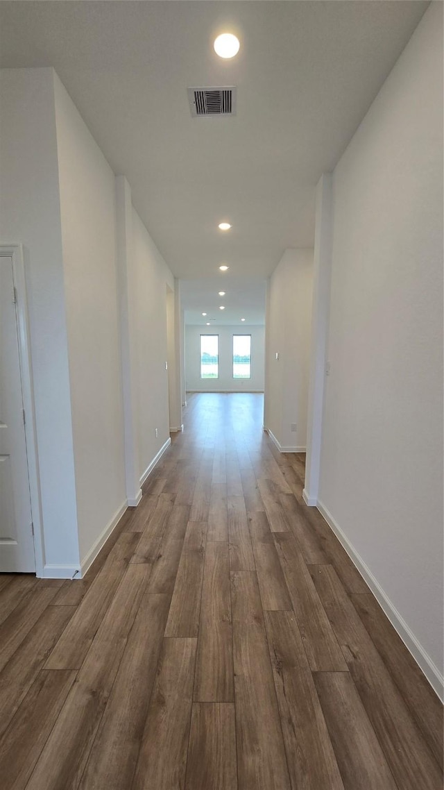 corridor featuring wood-type flooring