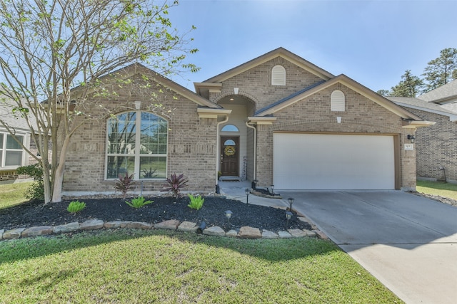 view of front of home with a front lawn and a garage