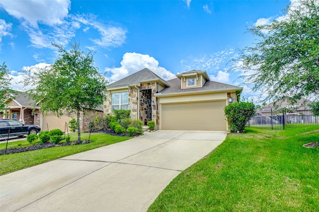 view of front of home with a front yard and a garage