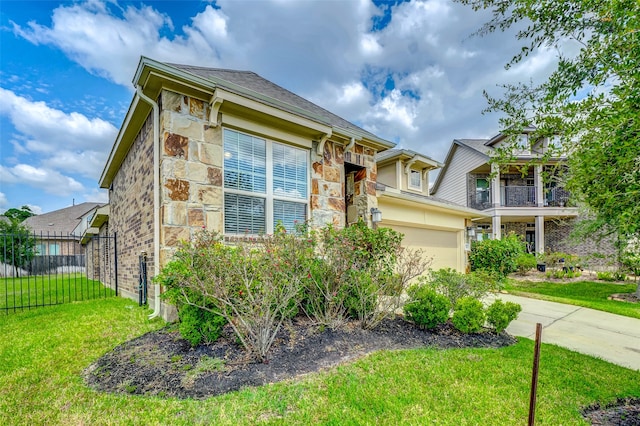 view of front facade featuring a front lawn and a garage