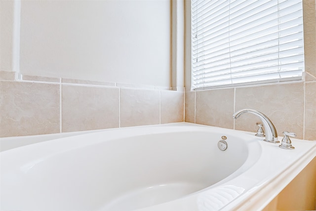 bathroom with tiled bath