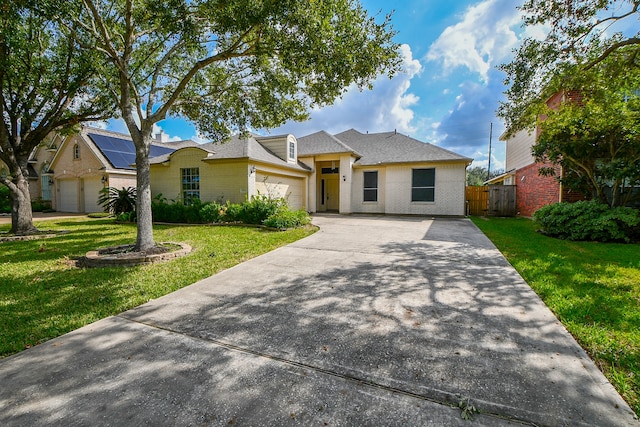 single story home with a garage and a front yard