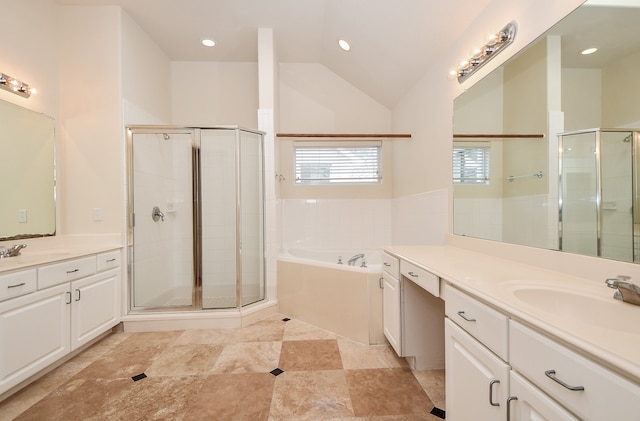 bathroom featuring shower with separate bathtub, lofted ceiling, and vanity