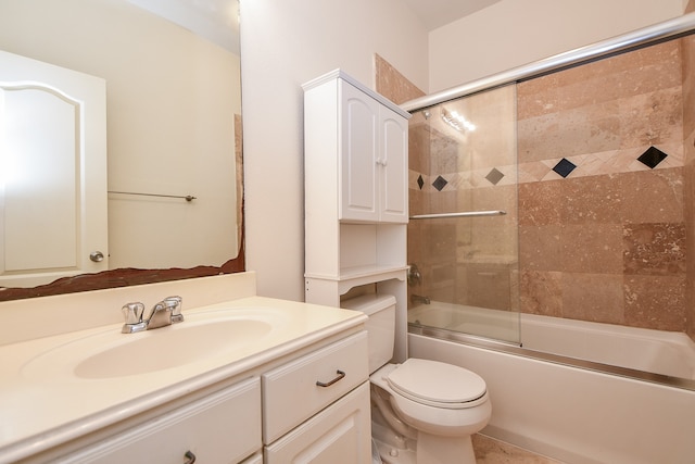 full bathroom with toilet, vanity, and enclosed tub / shower combo