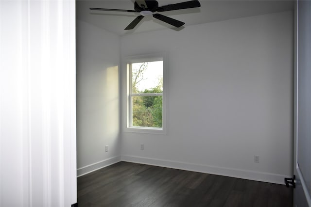 unfurnished room featuring dark hardwood / wood-style floors and ceiling fan