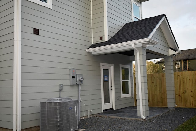 entrance to property featuring cooling unit