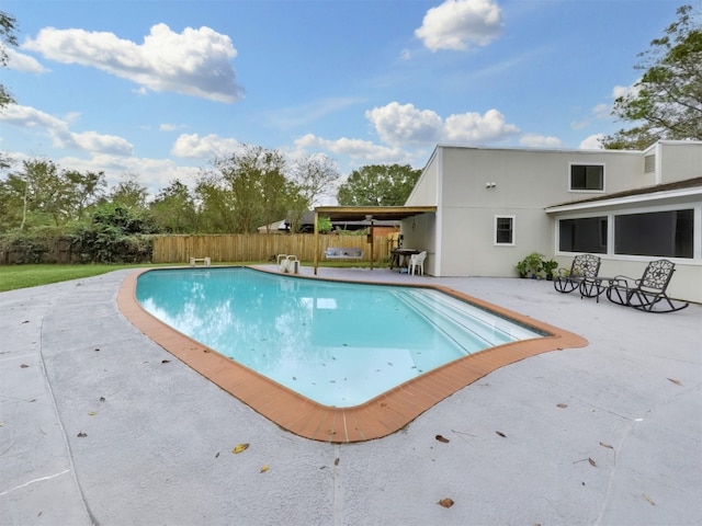 view of swimming pool with a patio