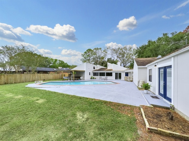 view of swimming pool with a patio area and a lawn