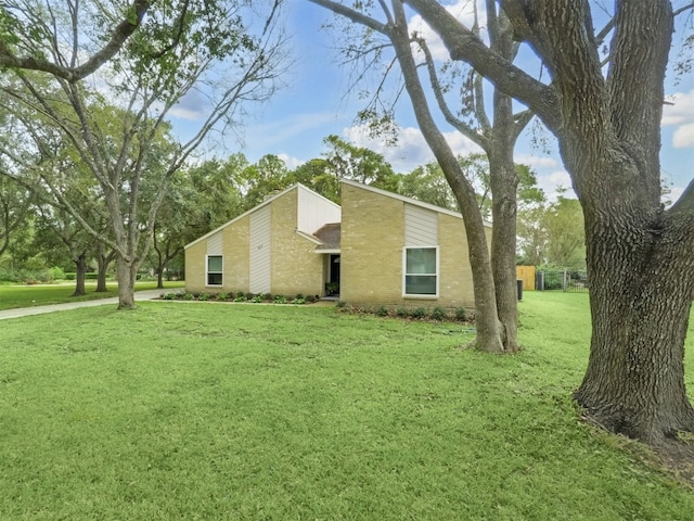 view of property exterior with a yard